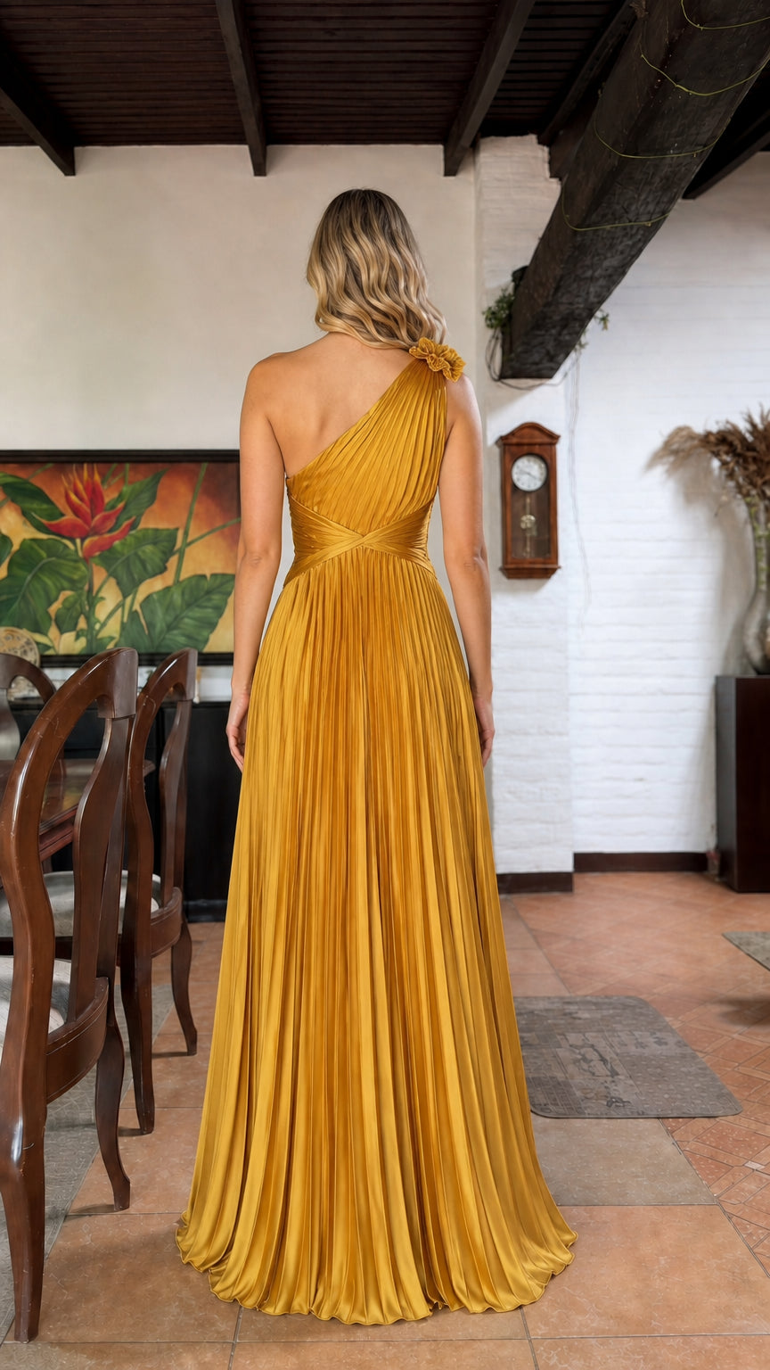 Back view of yellow one-shoulder pleated maxi dress