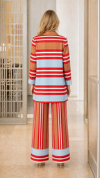 Back view of woman wearing brown striped blazer and trousers