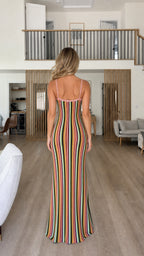 Back view of woman wearing multi-color striped knit cami maxi dress