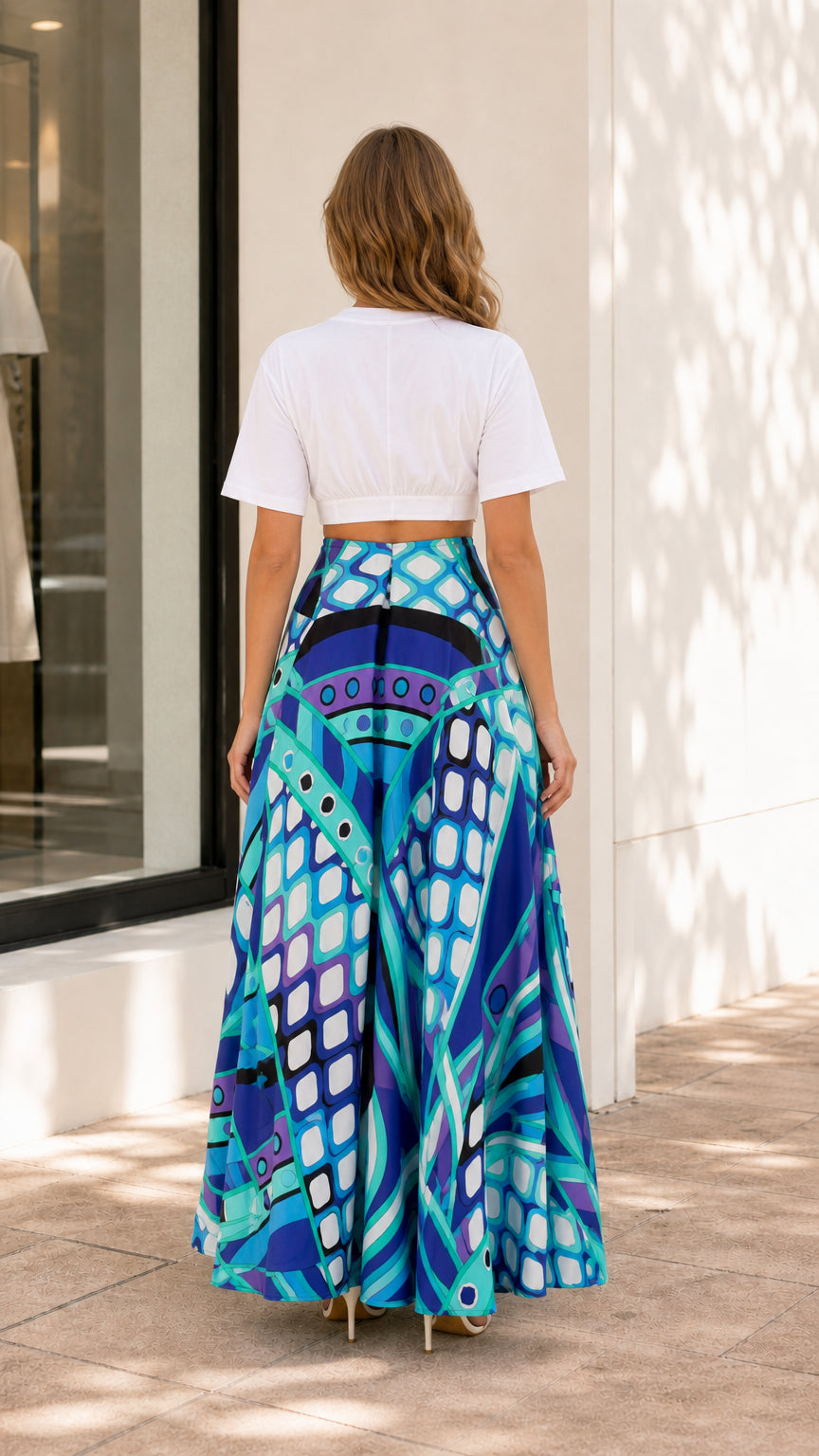Back view of model wearing blue geometric print maxi skirt