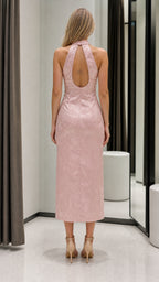 Back view of pink halter dress showing keyhole detail