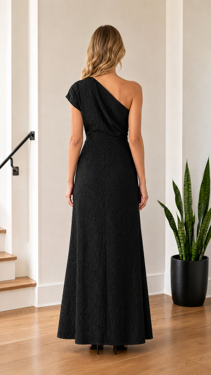 Model wearing Black one-shoulder maxi dress from back view