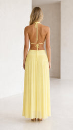 Back view of yellow halter neck cutout pleated maxi dress