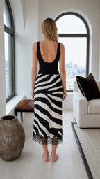 Back view of the black and white zebra print midi skirt with lace-trimmed hem