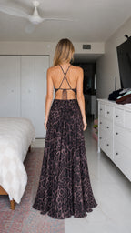 Back view showcasing criss-cross straps of the halter maxi dress