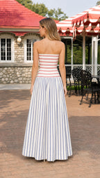 Model wearing blue and white striped strapless maxi dress, back view