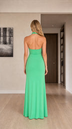 Back view of green halter maxi dress showing open back