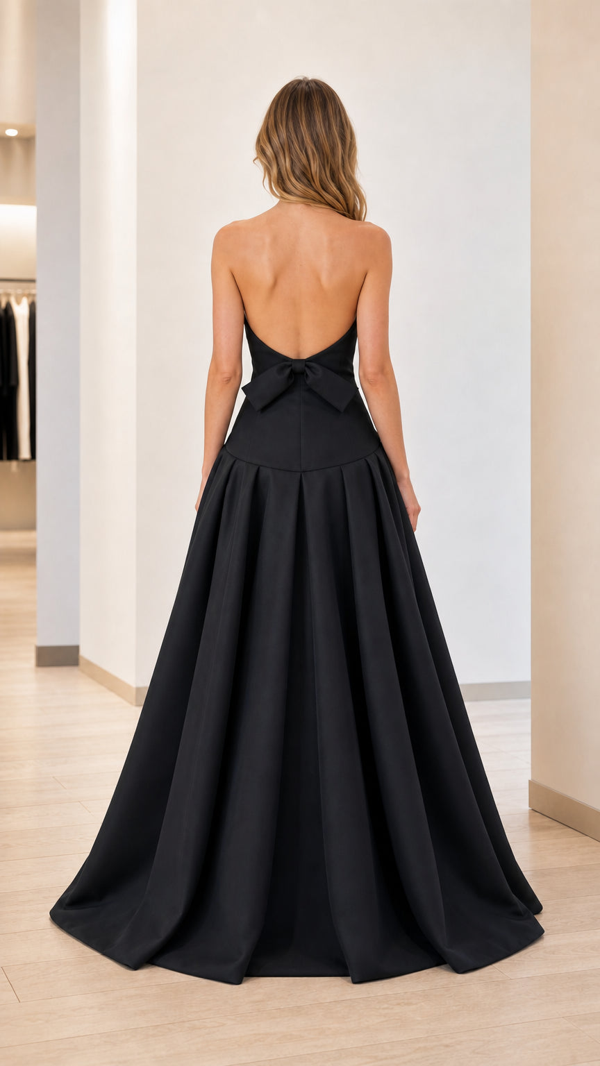 Back view of black evening gown with bow detail