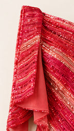 Close-up detail of red sequin fabric and drape
