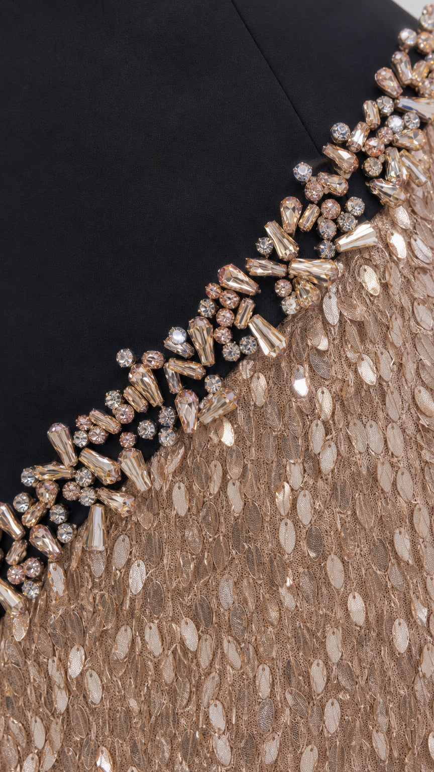 Close-up of crystal and bead embellishment on the black evening dress