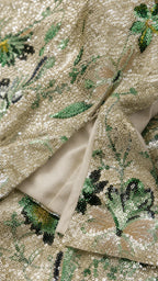 Close-up detail of floral sequin fabric and hemline