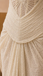 Close-up detail of the structured bodice and intricate lace texture