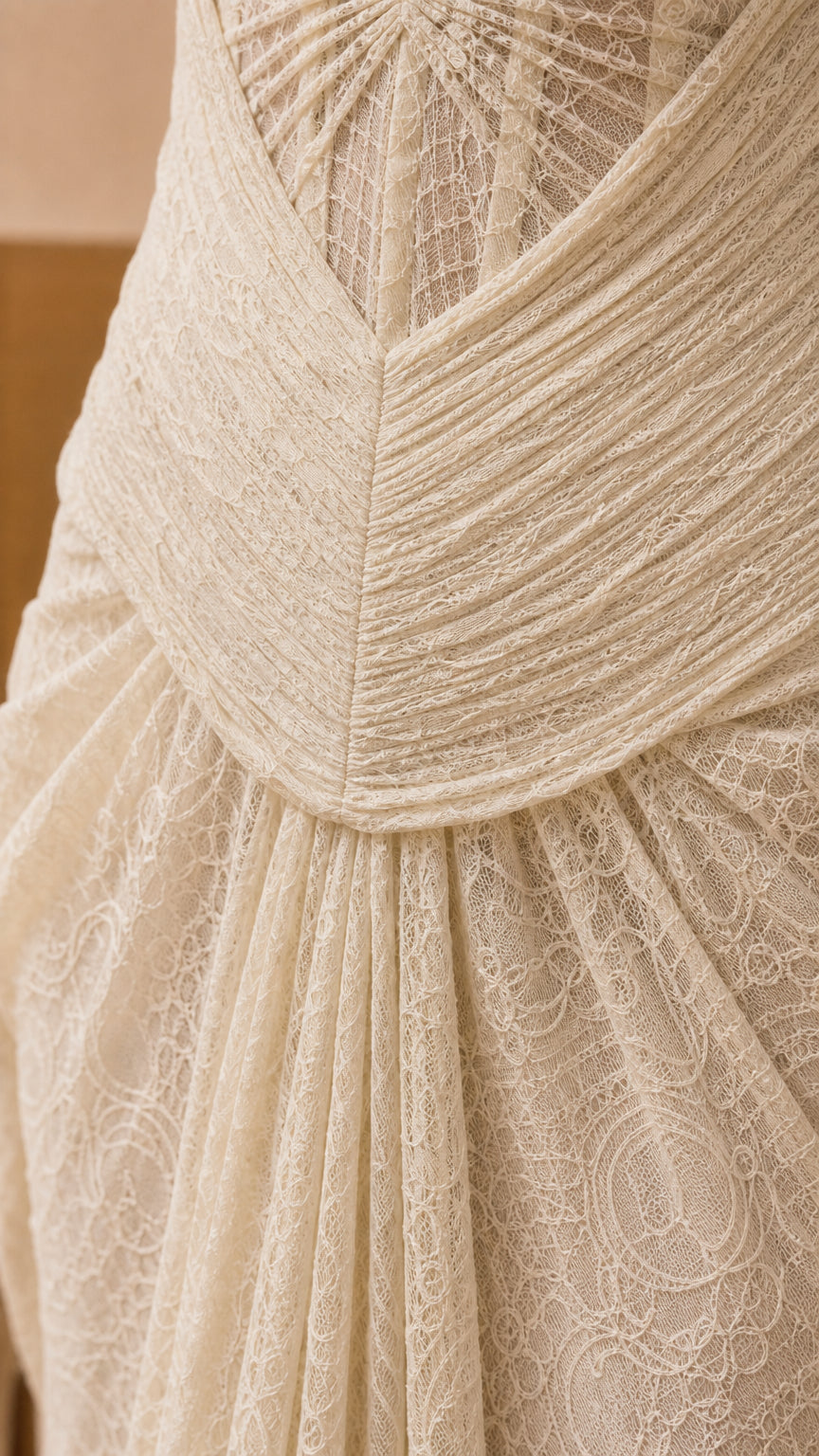 Close-up detail of the structured bodice and intricate lace texture