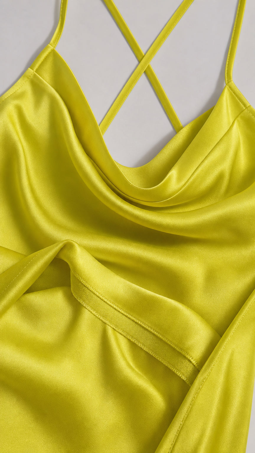 Close-up of yellow satin fabric and strap construction