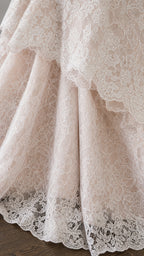Close up detail of layered scalloped lace hem