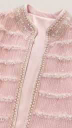Close-up of pink tweed jacket detailing and beadwork