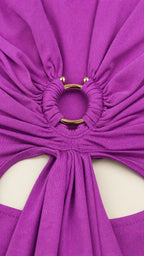 Close-up detail of the metallic O-ring, gathers, and front cutout
