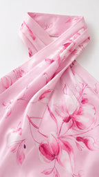 Close-up detail of smooth pink fabric and floral print pattern