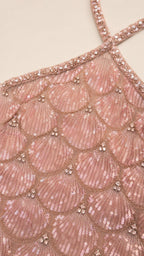 Close-up detail of scalloped sequin pattern and beaded halter strap