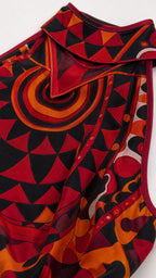 Close up of red geometric print fabric and halter neckline detail