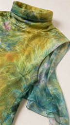 Close-up of fabric texture and cowl neckline detail
