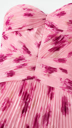 Close-up detail of ruched bodice and pleated texture in pink floral