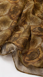 Close-up of lightweight olive paisley fabric texture