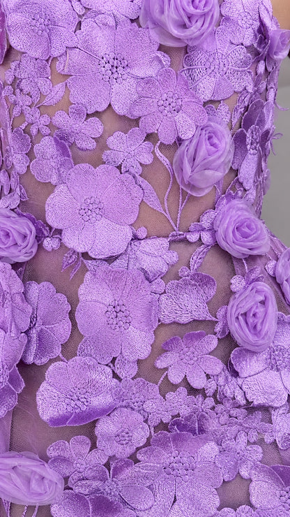 Close-up detail of 3D fabric roses and embroidery on lavender dress