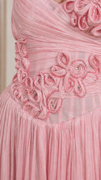 Close-up of handmade floral appliques and bodice detailing on pink dress