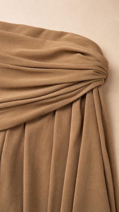 Close-up detail of the draped and knotted bodice texture