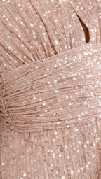 Close-up of champagne sequin fabric and ruched waist