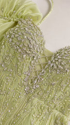 Close-up of crystal beadwork and ruffle shoulder detail