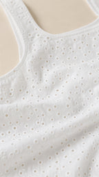Close up texture of white eyelet embroidery fabric