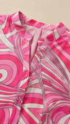 Close-up of pink abstract print fabric and collar detail