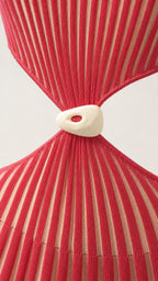 Close-up detail of the waist cut-out and center hardware accent