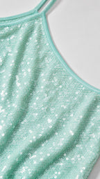 Close up of mint sequin fabric and straps
