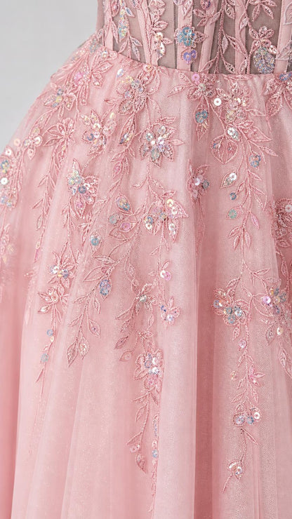 Close-up detail of floral appliques and sequins on bodice