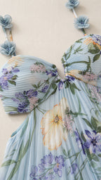 Close-up detail of pleated bust and 3D floral strap embellishments