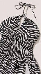 Close up of bodice and halter tie detail of zebra print dress