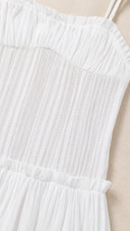Close-up detail of White pleated bodice and straps