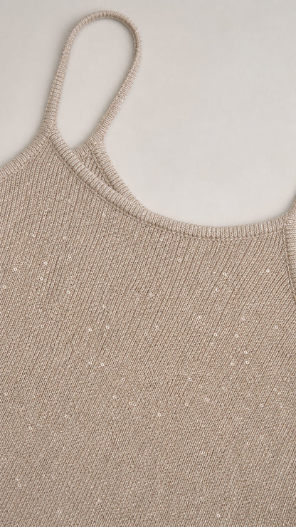 Close-up detail of the textured metallic champagne fabric and scoop neck
