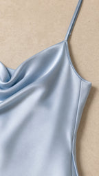 Close-up detail of smooth satin fabric and spaghetti strap