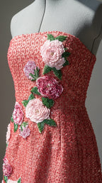 Close-up detail of floral appliques and beadwork