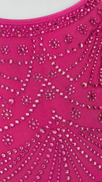 Close-up detail of rhinestone and bead pattern on hot pink fabric