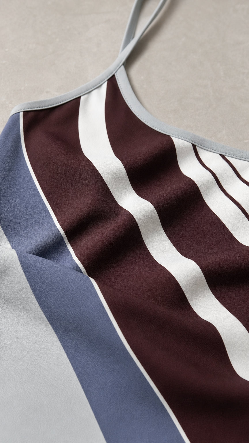 Close-up detail of fabric pattern and spaghetti strap