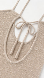 Close-up detail of straps, neckline, and sequin knit texture