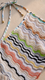 Close-up detail of multi-color chevron knit fabric and tie straps