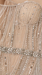 Close-up detail of bodice beadwork, sequins, and crystal waist belt