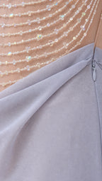 Close-up detail of crystal beading on sheer bodice and side zipper construction