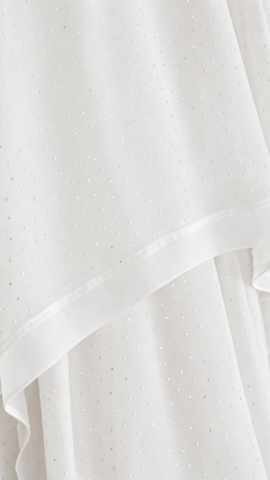 Close-up of white fabric texture with subtle dots